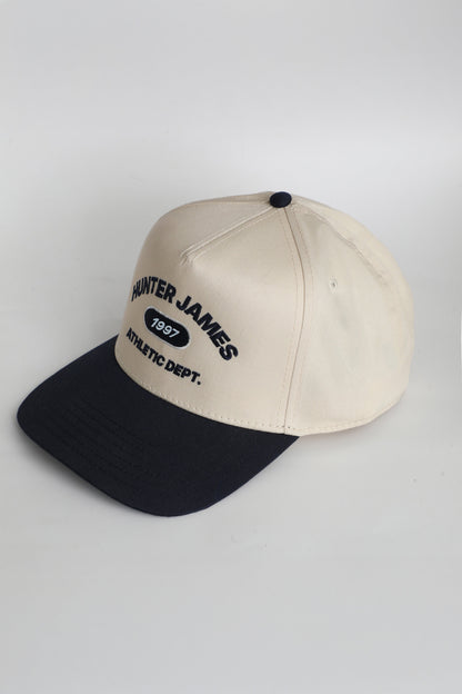 HUBER TRUCKER HAT | NAVY & NATURAL